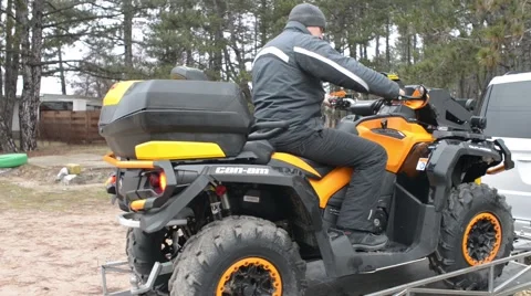 The Driver moves out on ATV with Trailer Stock Footage 60267409