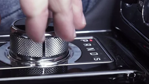 The driver moves the silver black gearshift of a luxurious car - closeup 스톡 동영상 192544029