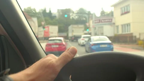 A driver navigates challenges on a rainsoaked road, showcasing control Видео 317340412