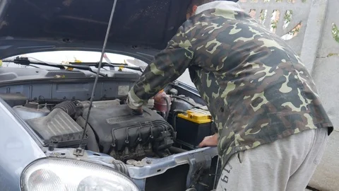 Driver open the hood and Checking car engine. Check car engine oil closeup Stock Footage 119466047