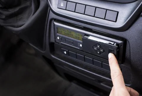 Driver opening a printer on a digital tachograph in a van. Paper roll Stock Photos