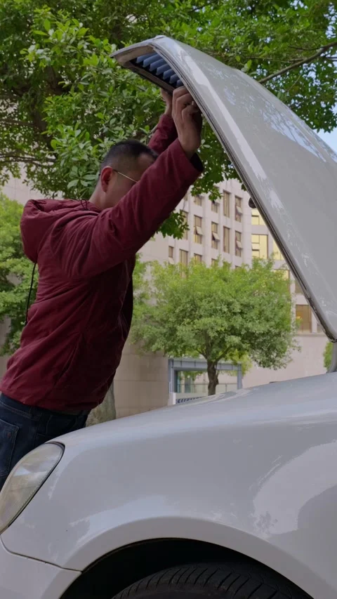 The driver opens the car hood. Stock Footage 329397687