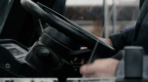 The driver operates the forklift Stock Footage 64689749