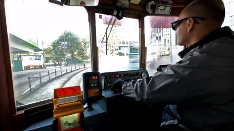 Driver operates tram through Hong Kong crowded streets Video stock 48216622