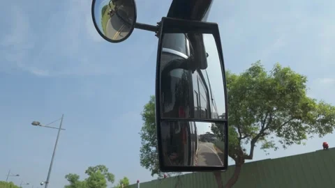 Driver Perspective from a Tour Bus Showing Convex Mirrors During Road Travel Stock Footage 341527699
