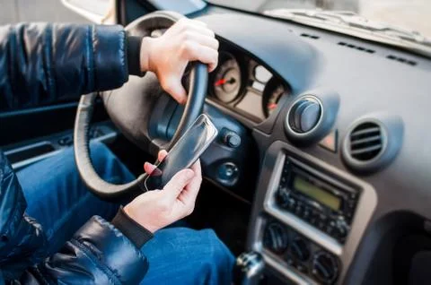 The driver with phone Stock Photos