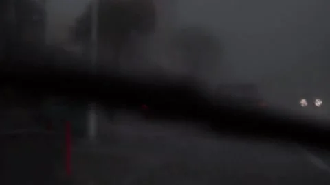 Driver point of view in moving car while raining Stock Footage 132446084