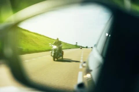 Driver point of view in rear view mirror Stock Photos
