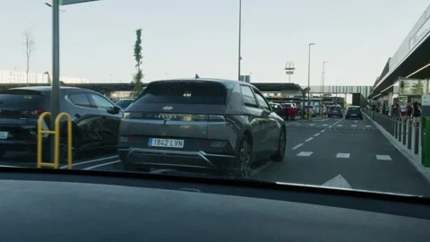 Driver point of view slowly moving through a large outdoor parking lot at a.. Stock-Footage 338226537
