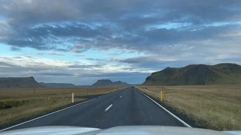 Driver point of view traveling along Iceland's Ring Road through open plains Stock Footage 345969094