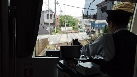 Driver point of view at vintage cockpit with commands. Sakura Train Tram. Stock Footage 124979047