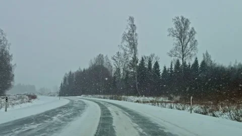 Driver POV Icy Winter Road Snowfall Latvia Rural Highway Dangerous Driving Stock Footage 333325681