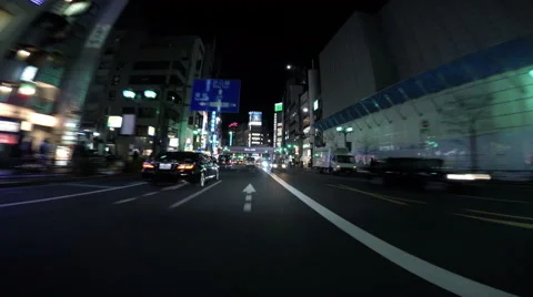Driver POV through Roppongi crossing and neons. Video stock 61631353