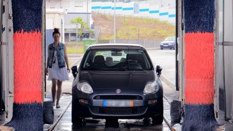 Driver preparing for a trip after car wash Stock Footage 129513008