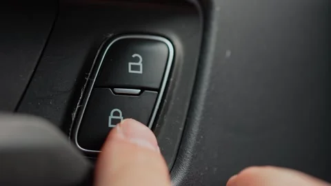 Driver press lock button for locking the vehicle door. Person push car door.. Video stock 293844755