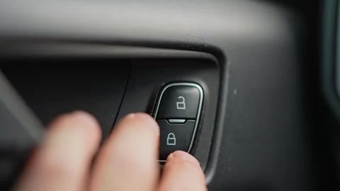 Driver press lock button for locking the vehicle door. Person push car door.. Video stock 293844770