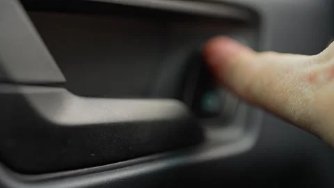 Driver press unlock button to unlocking the vehicle door. Person push car d.. Stock-Footage 293844756