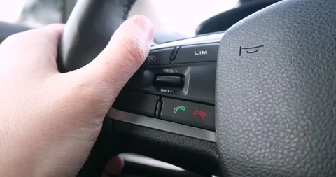 The driver presses the button to pick up the phone Stock Footage 260675323