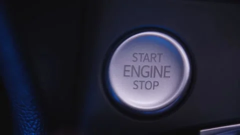 The driver presses the engine start button close-up Stock Footage 221739364