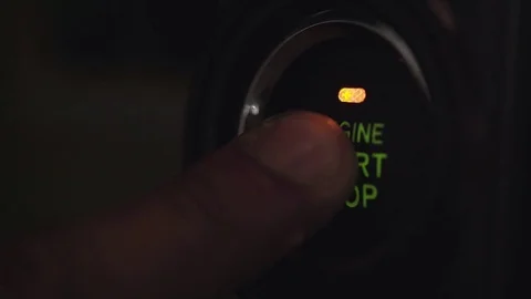 Driver pressing an automatic start button Stock Footage 71535601