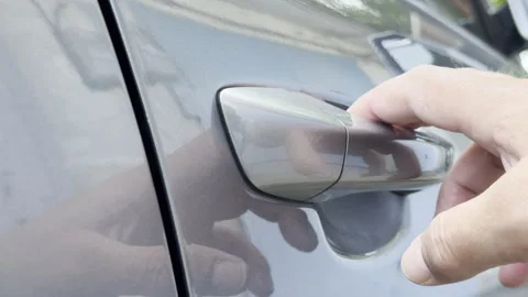 Driver Pulls Metallic Car Door Handle Open Outdoors Stock Footage 336863885