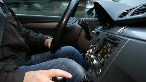 The driver pulls the phone while driving. Close-up Stock Footage 86064912