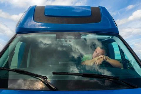 Driver reflecting in truck windshield view Fotos de archivo