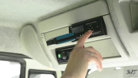 Driver removes a digital tachograph reader from the tachograph. Tachograph Stock Footage 171064297