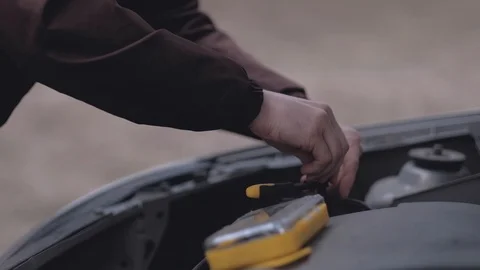 Driver repairing broken car. Stock Footage 107609529