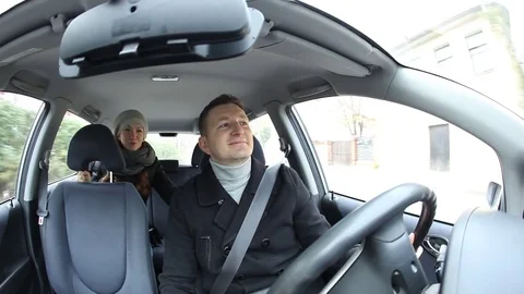 Driver ride small car, young woman speak with him from back seat 스톡 동영상 71619851