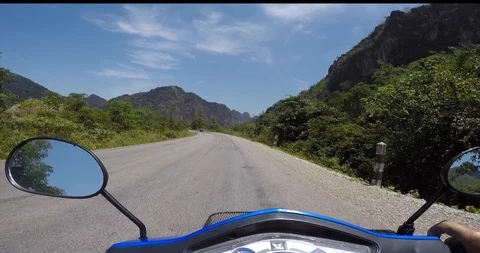 Driver riding motorcycle on Thakhek Loop, Thakhek, Laos Stock Footage 92170977