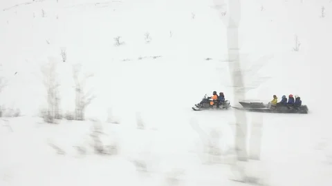 Driver riding snowmobile attraction move along wide valley Video stock 109207150