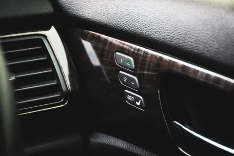 Driver seat memory button with two memory position on a door panel. Foto stock