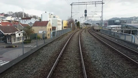 Driver seat view from inside passenger train arriving at Sandnes station - Video stock 172361234