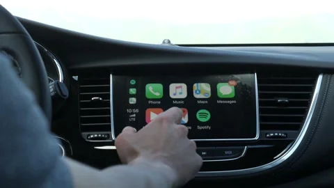 Driver selects music on the car lcd 스톡 동영상 144946005