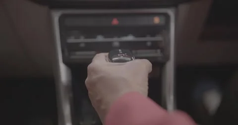 Driver shifting an automatic car gear lever into drive mode. Stock-Footage 330155920