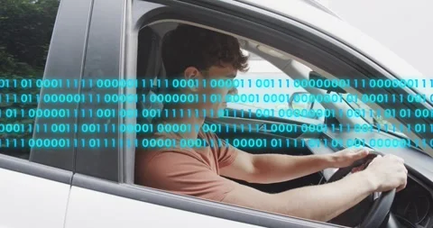 Driver shifting in car while moving hands to wheel, binary code sweeping as Stock Footage 323430659