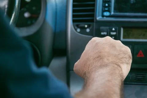 Driver shifting gears while driving minivan Stock-Fotos