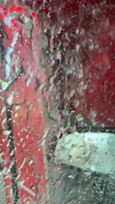 Driver Side Mirror and Window Washing in Automatic Car Wash Stock Footage 333050988