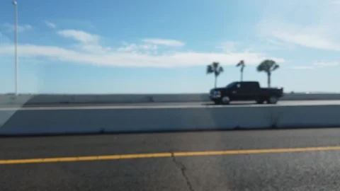 Driver Side Reflection In Widow Driving Over Bridge Florida Keys Stock Footage 127330299