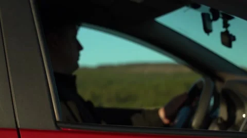 The driver sits behind the wheel and starts to move Stock Footage 154091252