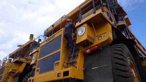 Driver sits in a big mining truck Video stock 114827726