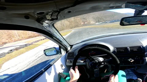Driver skilfully steering wheel, switching gearbox and making abrupt maneuvers Stock Footage 229294670
