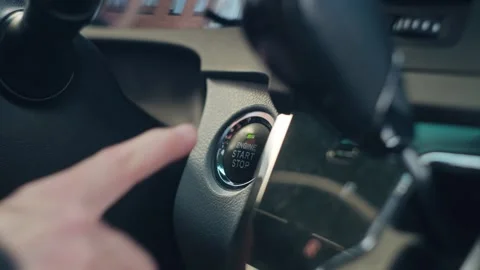 Driver Starting a Car with a Push Button Ignition Stock Footage 330605869