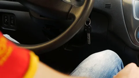 The driver starts the car with key Stock Footage 89293636
