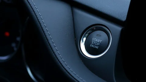 Driver starts the car by pressing the start button Stock Footage 126047907