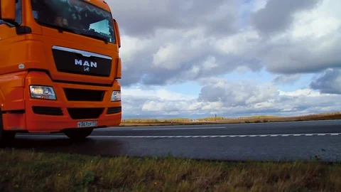 Driver starts motion of the cargo TIR transportation truck from parking lot Stock Footage 83417175