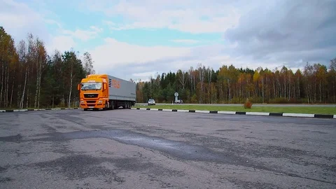 Driver starts motion of the cargo TIR transportation truck from parking lot Stock Footage 83417204