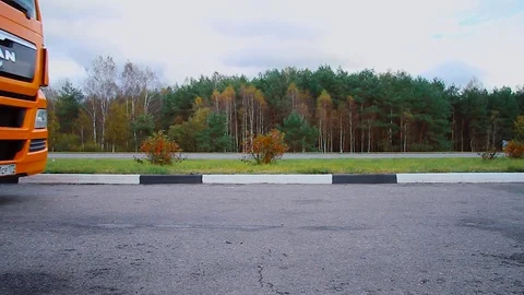 Driver starts motion of the cargo TIR transportation truck from parking lot Stock Footage 83417324