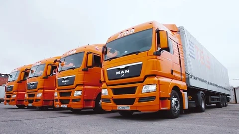Driver starts motion of the cargo TIR transportation truck from parking lot Stock Footage 83417910